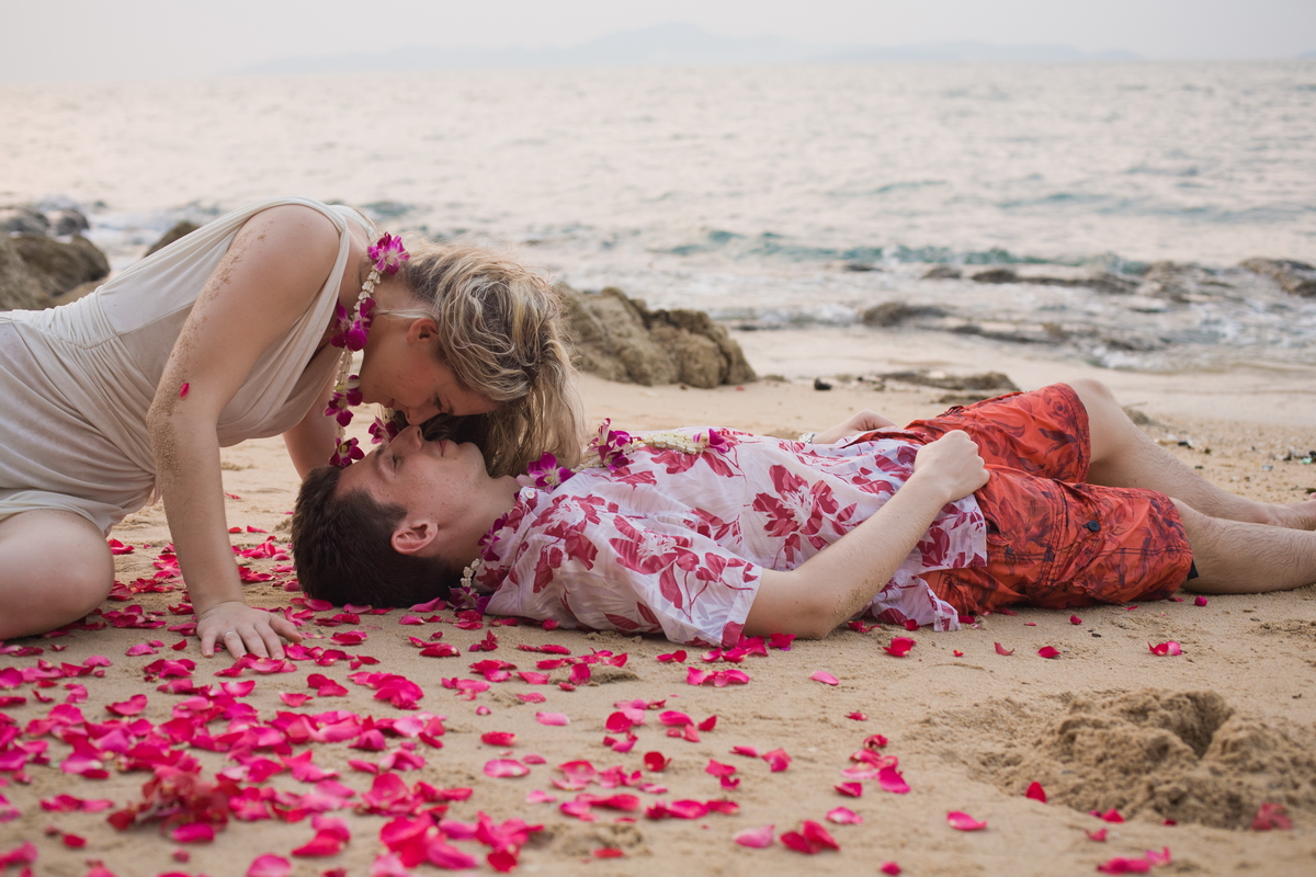Newlyweds in rose petals