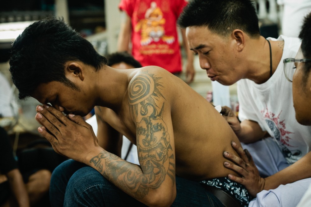 Thailand monks make a tattoo Sak Yant