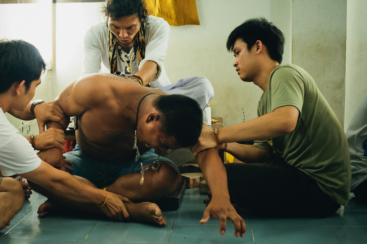 Thailand monks make a tattoo Sak Yant